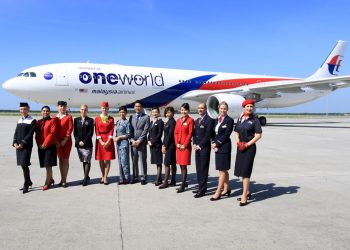 Flight Attendents Showing Off MH Oneworld Livery
