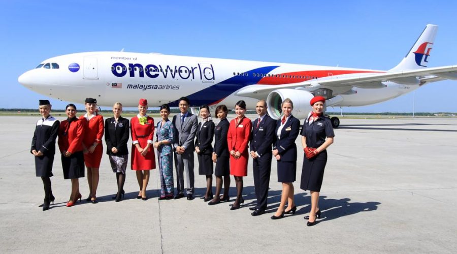 Flight Attendents Showing Off MH Oneworld Livery