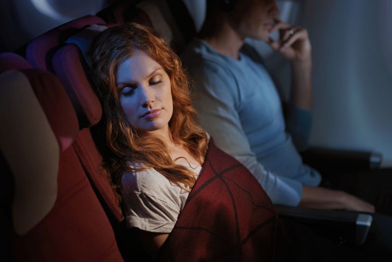 Qantas reshapes long-haul flying - a passenger sleeps happily