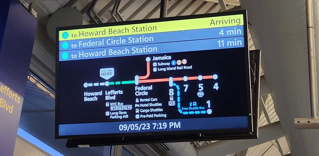 Information boards at AirTrain stations show accurate departure times and routes.